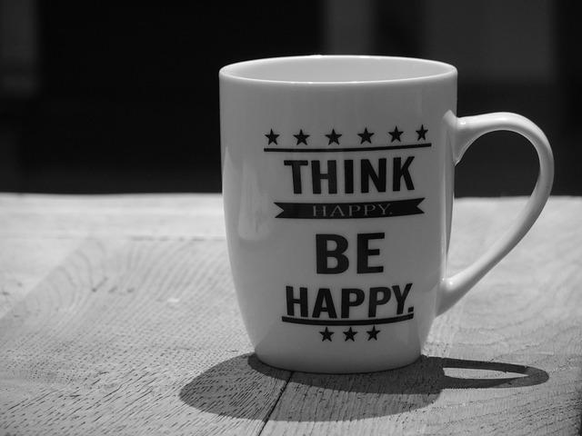 Keeping a positive mindset - coffee cup that says think happy, be happy