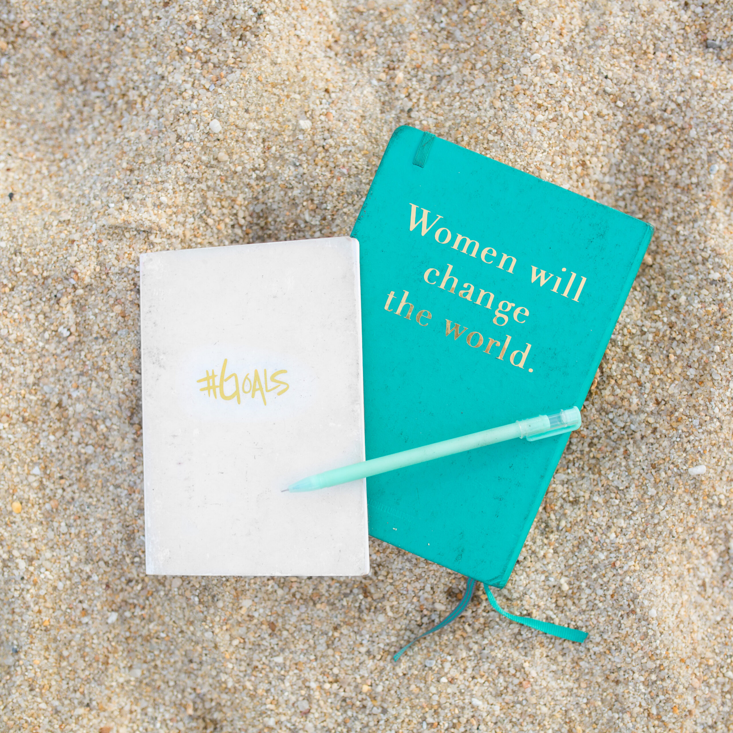2 notebooks on the beach - women will change the world and #goals Hack Your habits