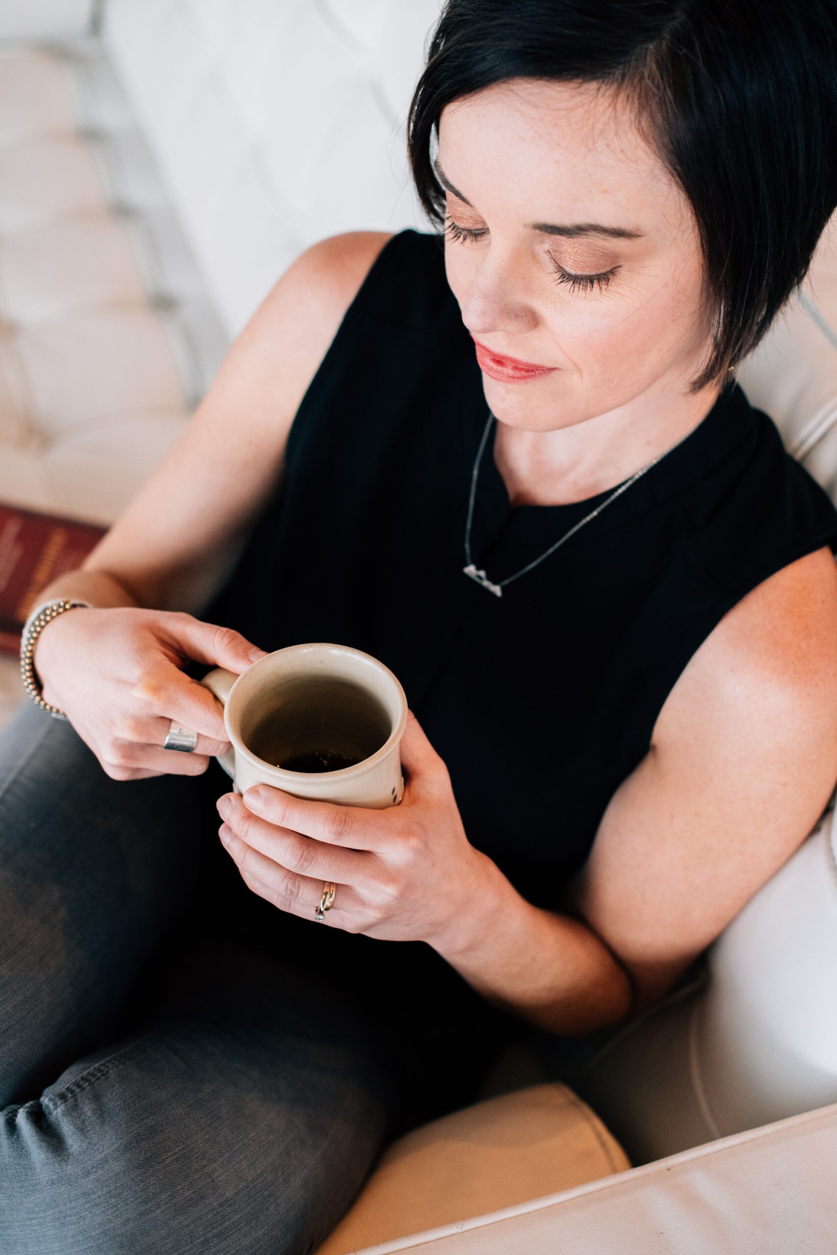 woman enjoying a cup of coffee as part of her self-care