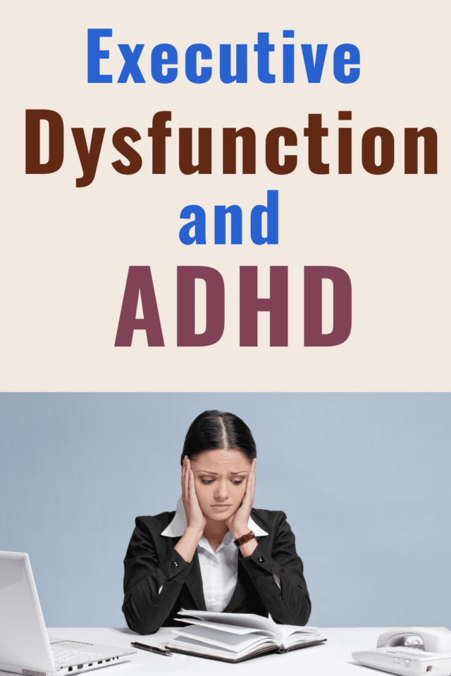 executive dysfunction and ADHD - and overhwelmed woman sitting at a white desk in front of her computer and planner, holding her face